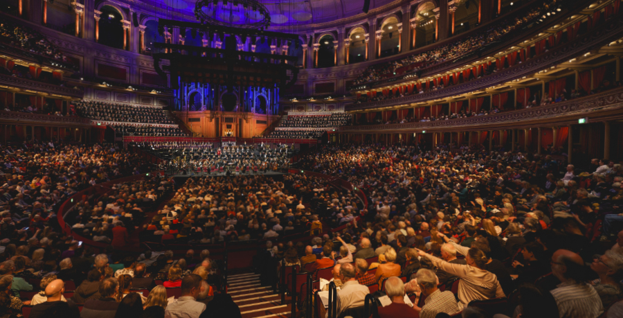 A wide shot of Royal Philharmonic Orchestra and mass chorus Royal Albert Hall with a full audience