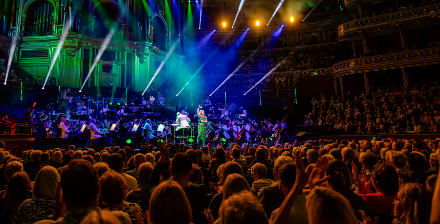 A crowd watching a Royal Philharmonic Orchestra Broadway music concert at the Royal Albert Hall